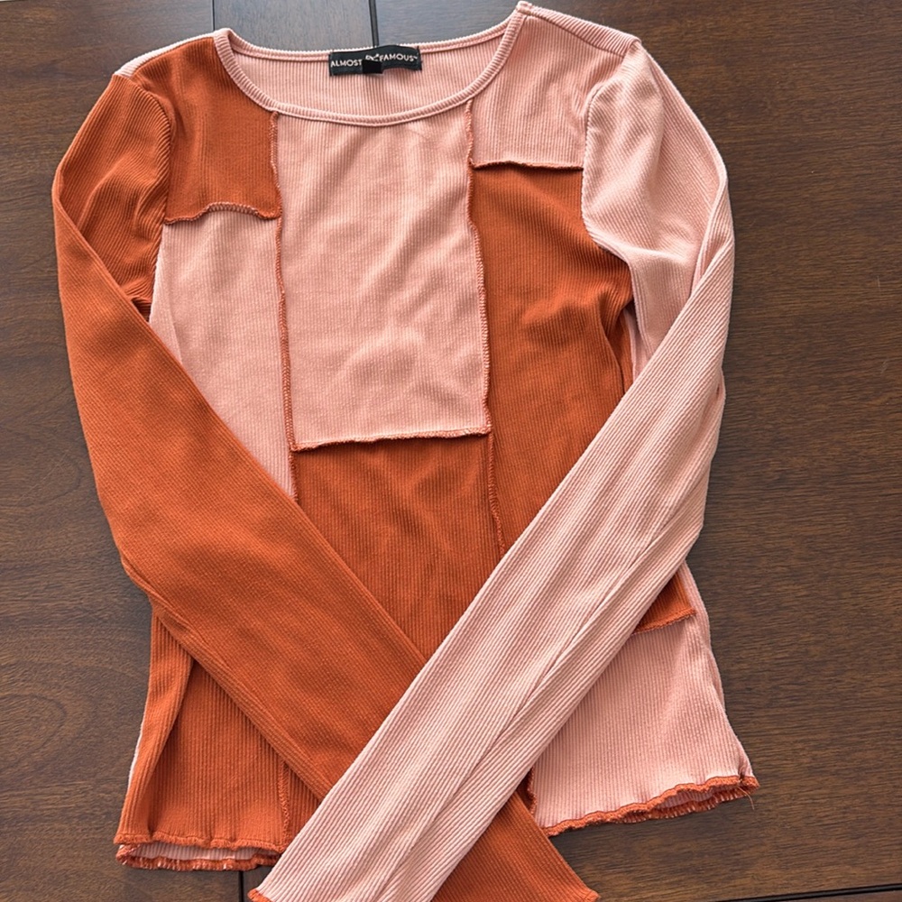 Almost Famous long sleeved shirt. Size: small. Color: Orange and pink